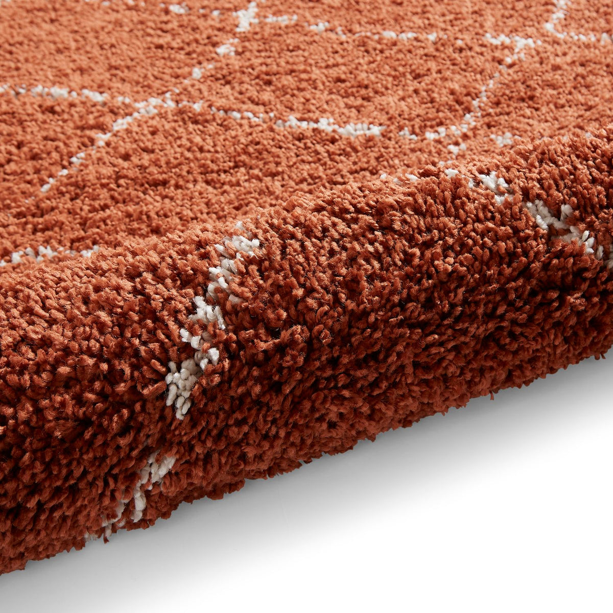 Rust Willow Shaggy Tasselled Diamond Rug from Roseland Furniture