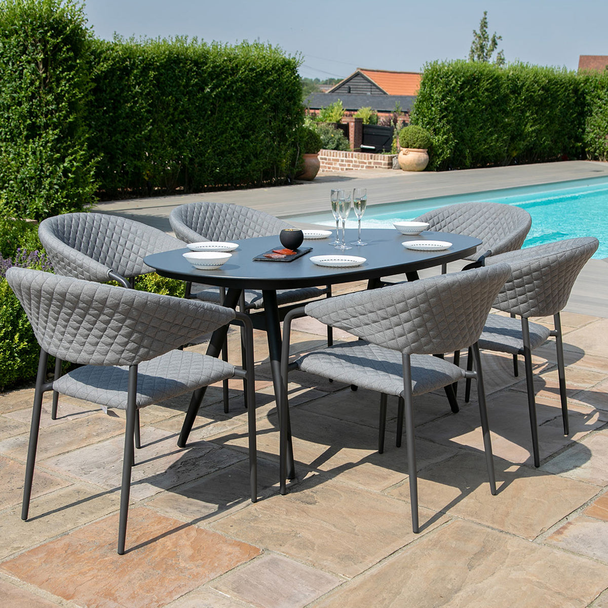 Maze Pebble Grey 6 Seat Outdoor Oval Dining Set from Roseland Furniture