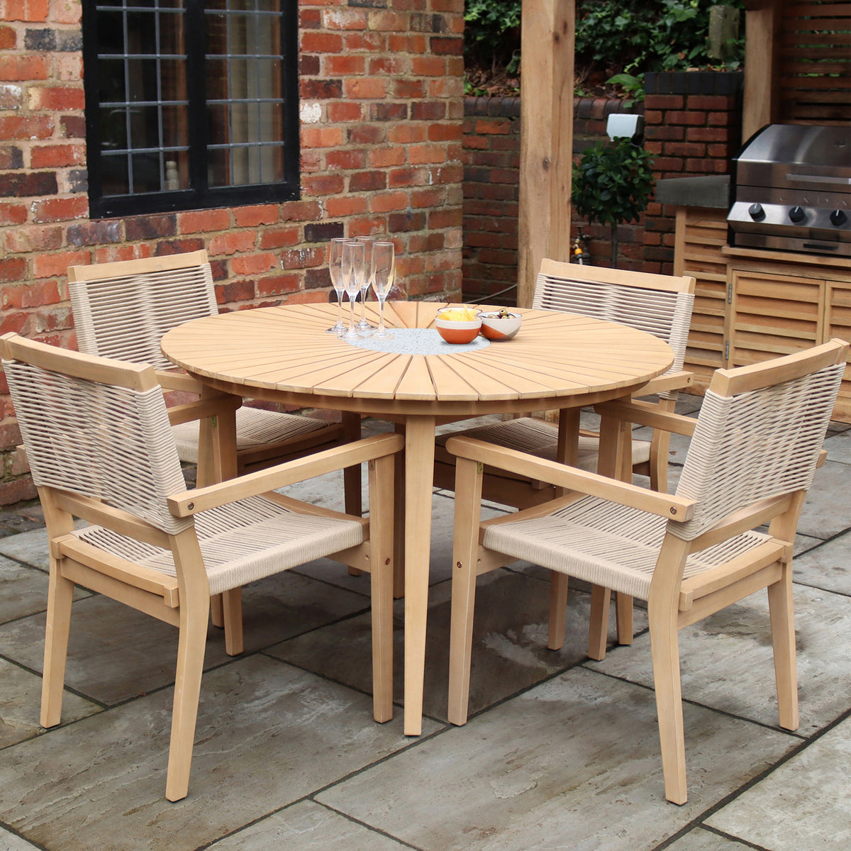Roma 120cm Round Table 4 Roma Rope Stacking Chairs Concrete Insert from Roseland Furniture