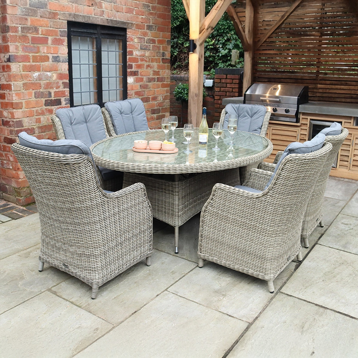 Wentworth 6 Seat Ellipse High Back Rattan Dining Set from Roseland Furniture