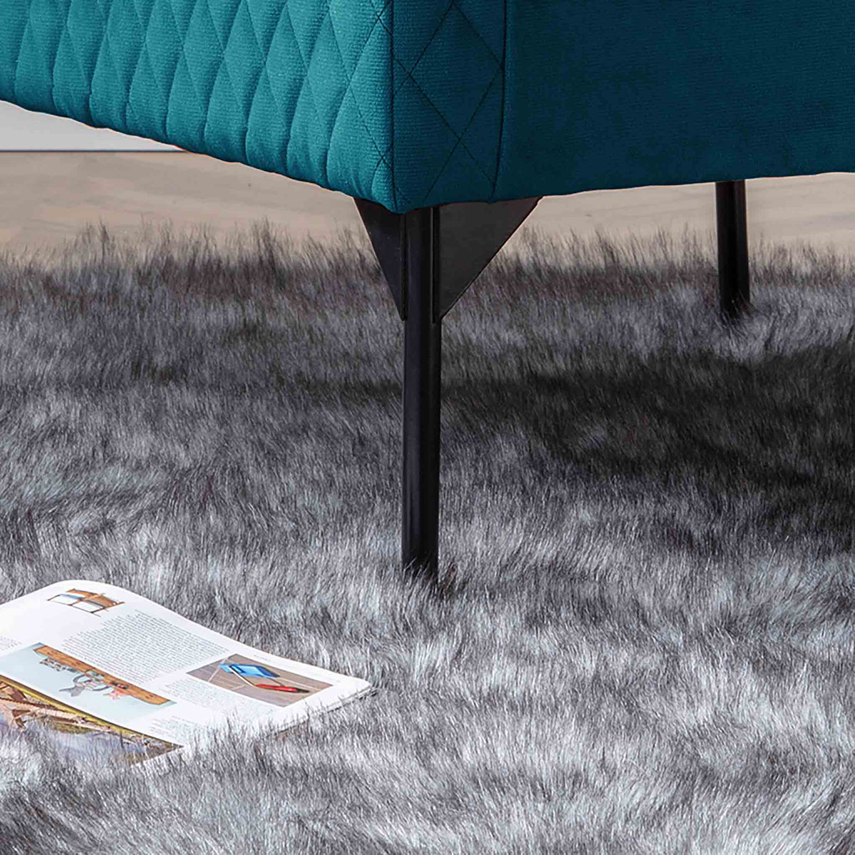 lifestyle close up of the legs on the Bali Peacock Velvet Accent Chair
