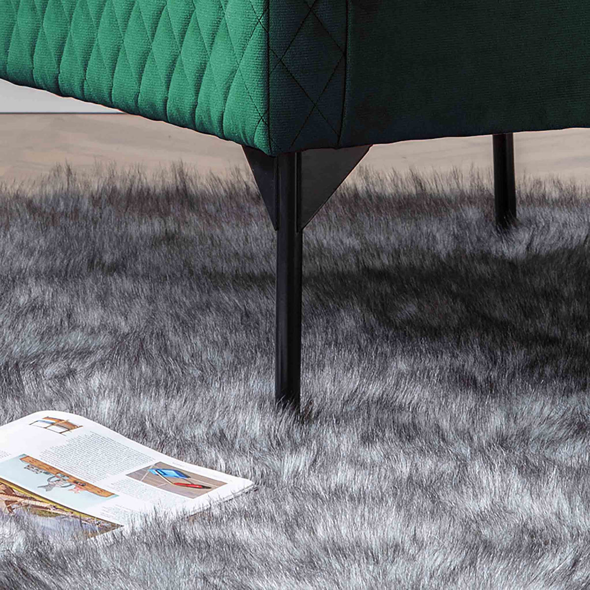 lifestyle close up of the black legs on the Bali Jasper Velvet Accent Chair