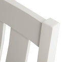 close up of the white wooden frame on The Padstow White Wooden Dining Chair with Padded Seat