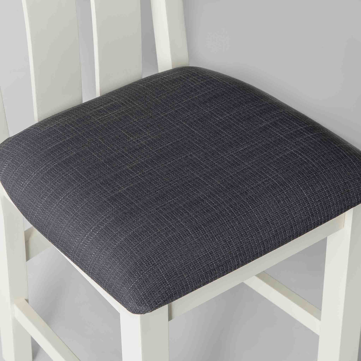 black fabric seat on The Padstow White Wooden Dining Chair 