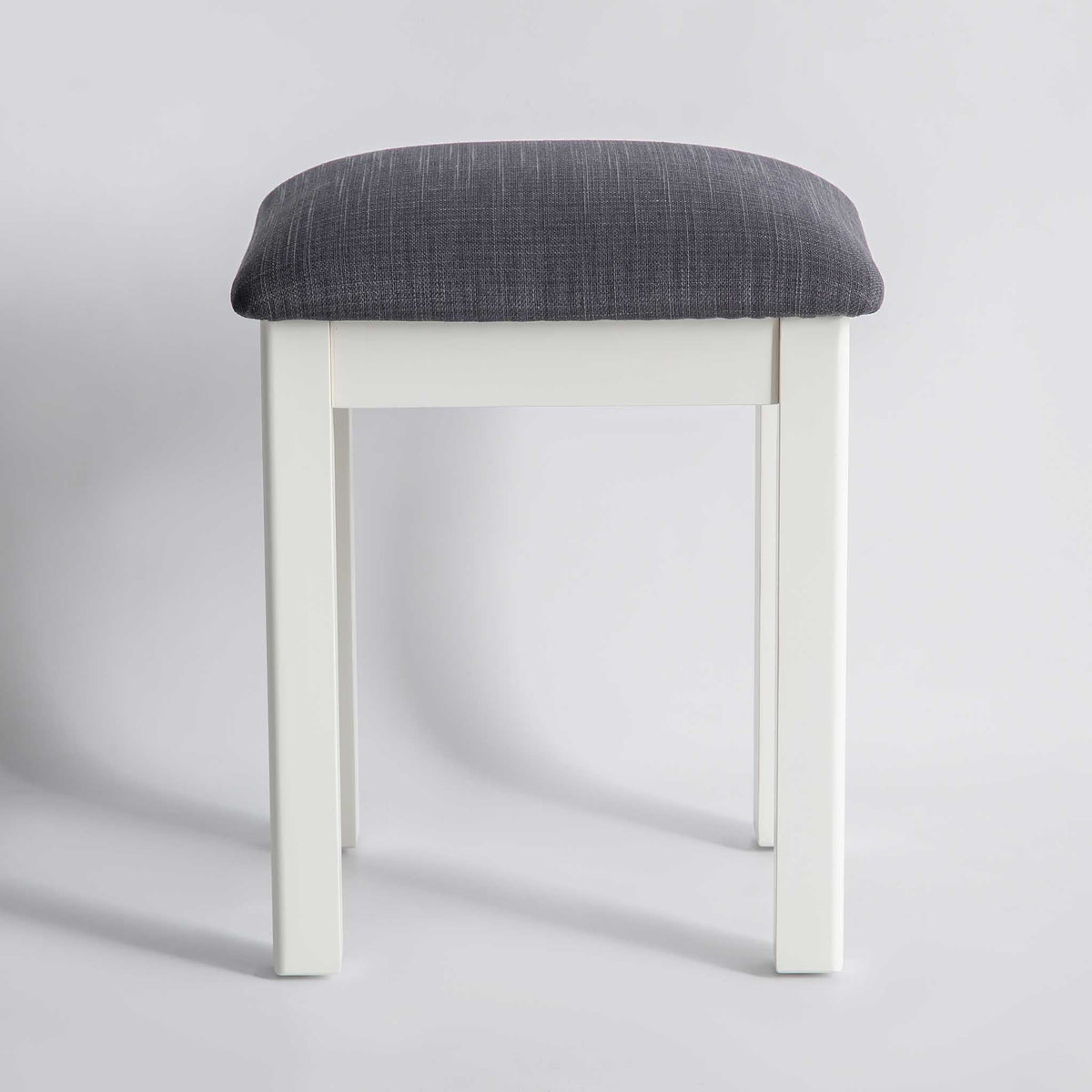 front view of The Padstow White Wooden Dressing Stool with Padded Seat