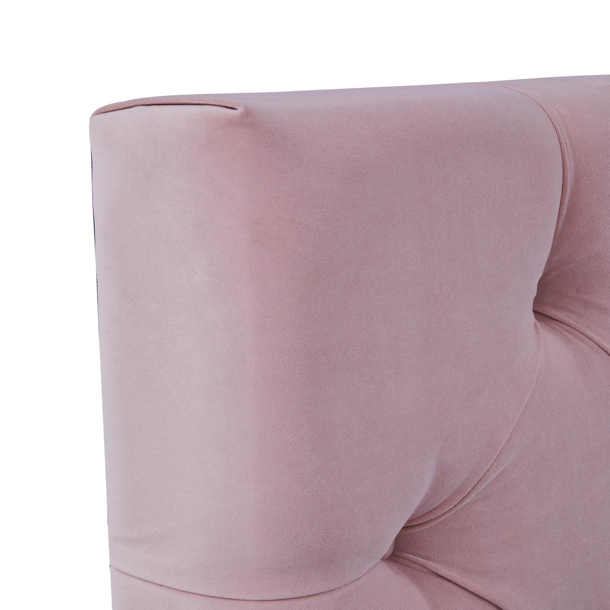 A dusty pink upholstered chair with a curved structure is shown against a white background.