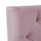 A dusty pink upholstered chair with a curved structure is shown against a white background.