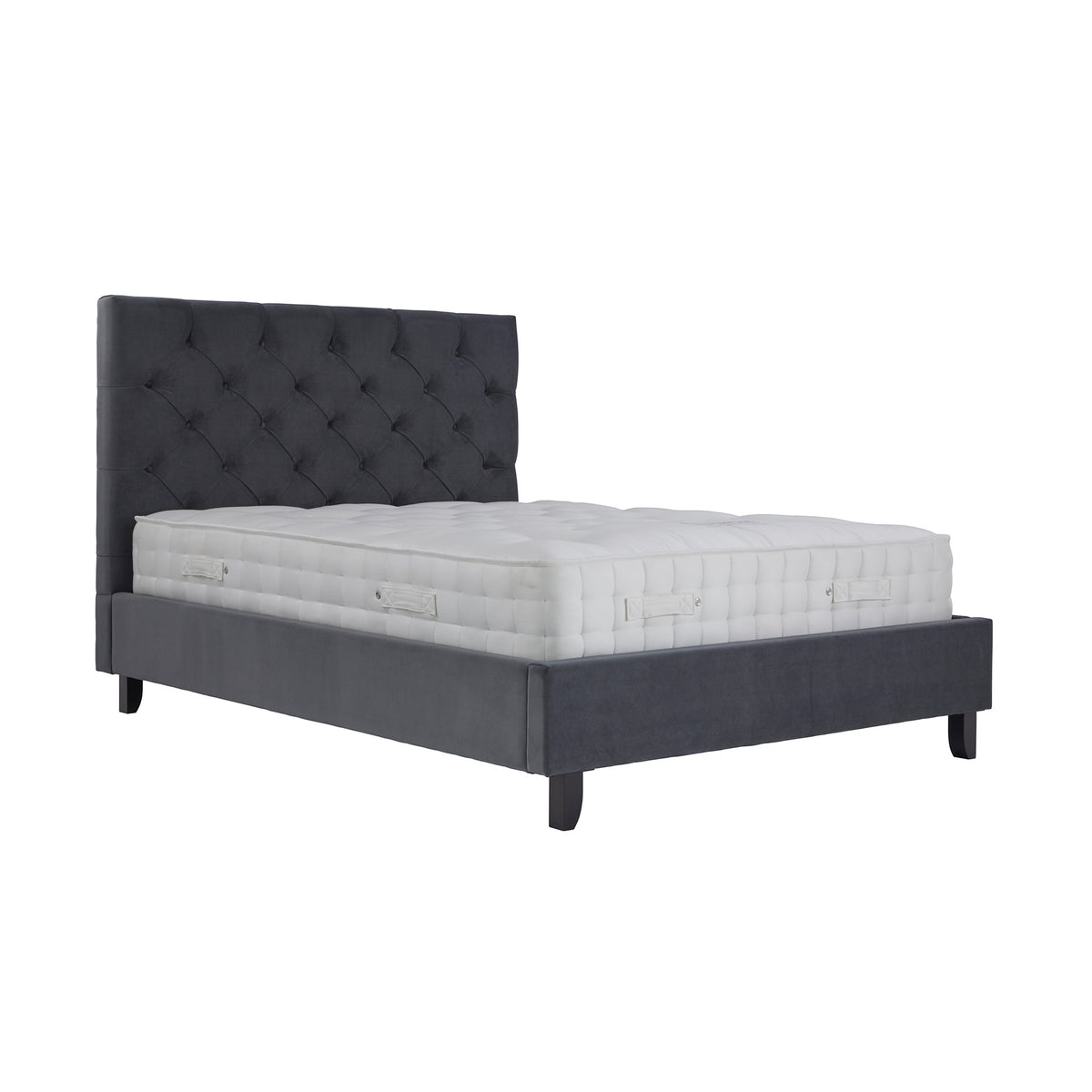 A dark gray upholstered bed with a tufted headboard and a thick white mattress, isolated against a white background.