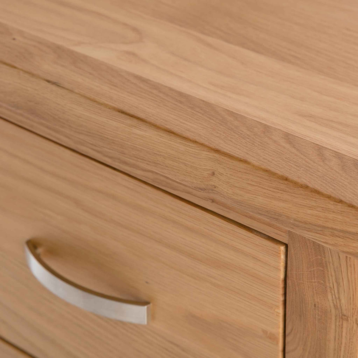 close up of the oak top edge on the London Oak Tallboy Chest by Roseland Furniture. 