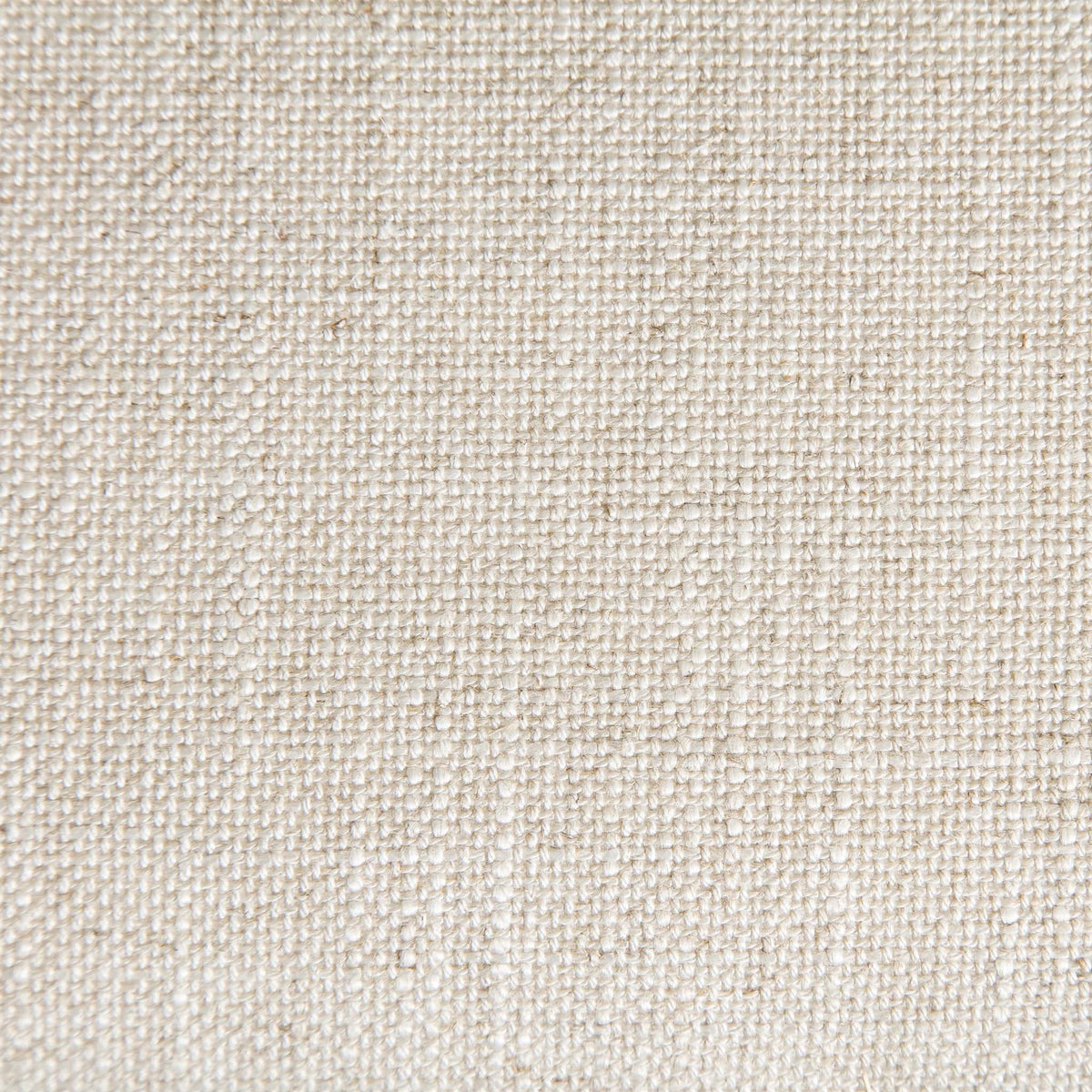 A close-up texture of beige fabric showcasing intricate weave detail with small, raised nodules spread consistently across the surface.