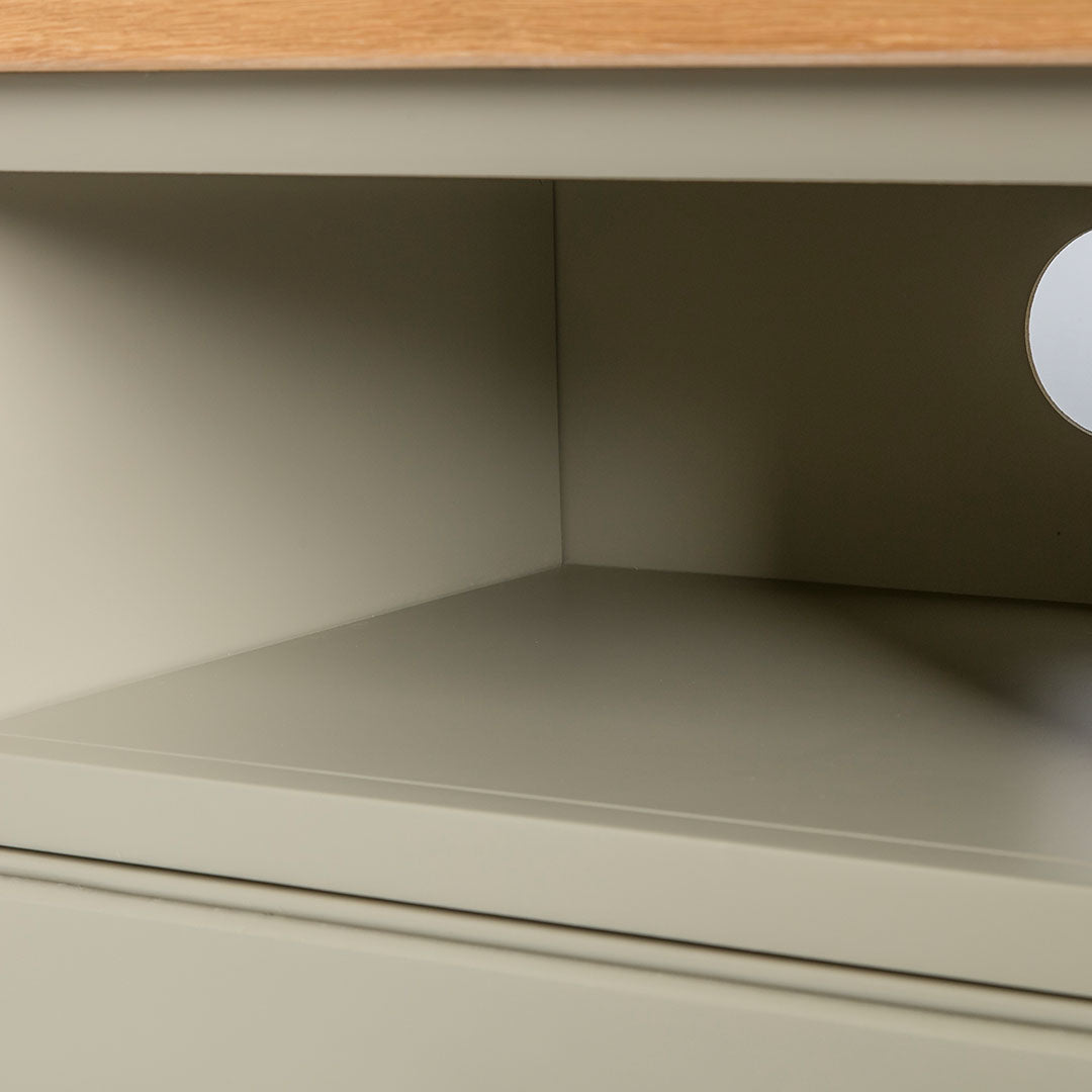 Close up of the open shelf on the Chichester Ledum Green Small TV Unit
