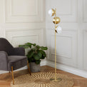 Estelle Brushed Brass Metal and White Orb Dome Floor Lamp lifestyle