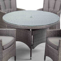 close up of the tempered glass on the Palma 120cm Round Rattan Dining Table