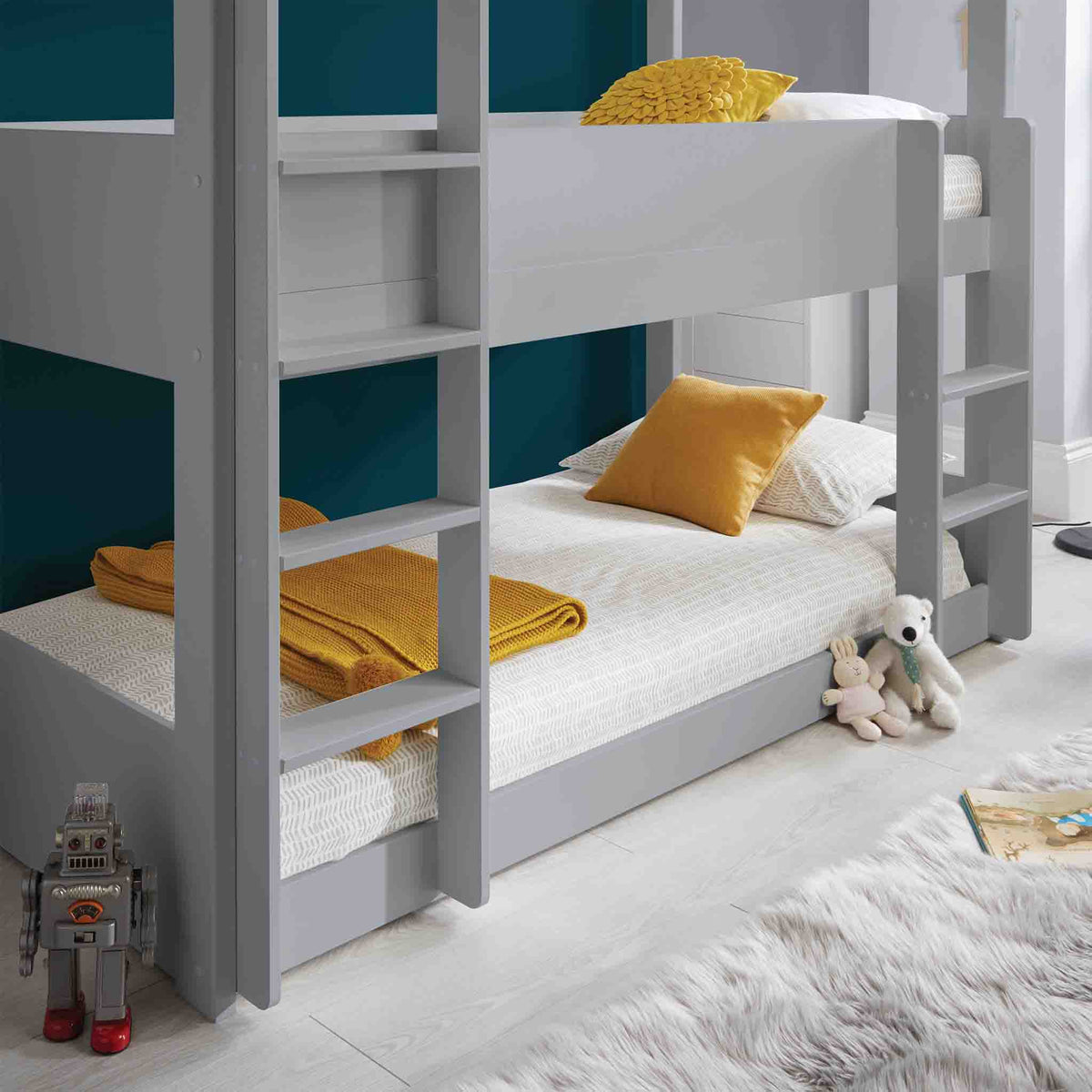 close up of the bottom bunk on the Trio Grey 3 Sleeper Wooden Bunk Bed