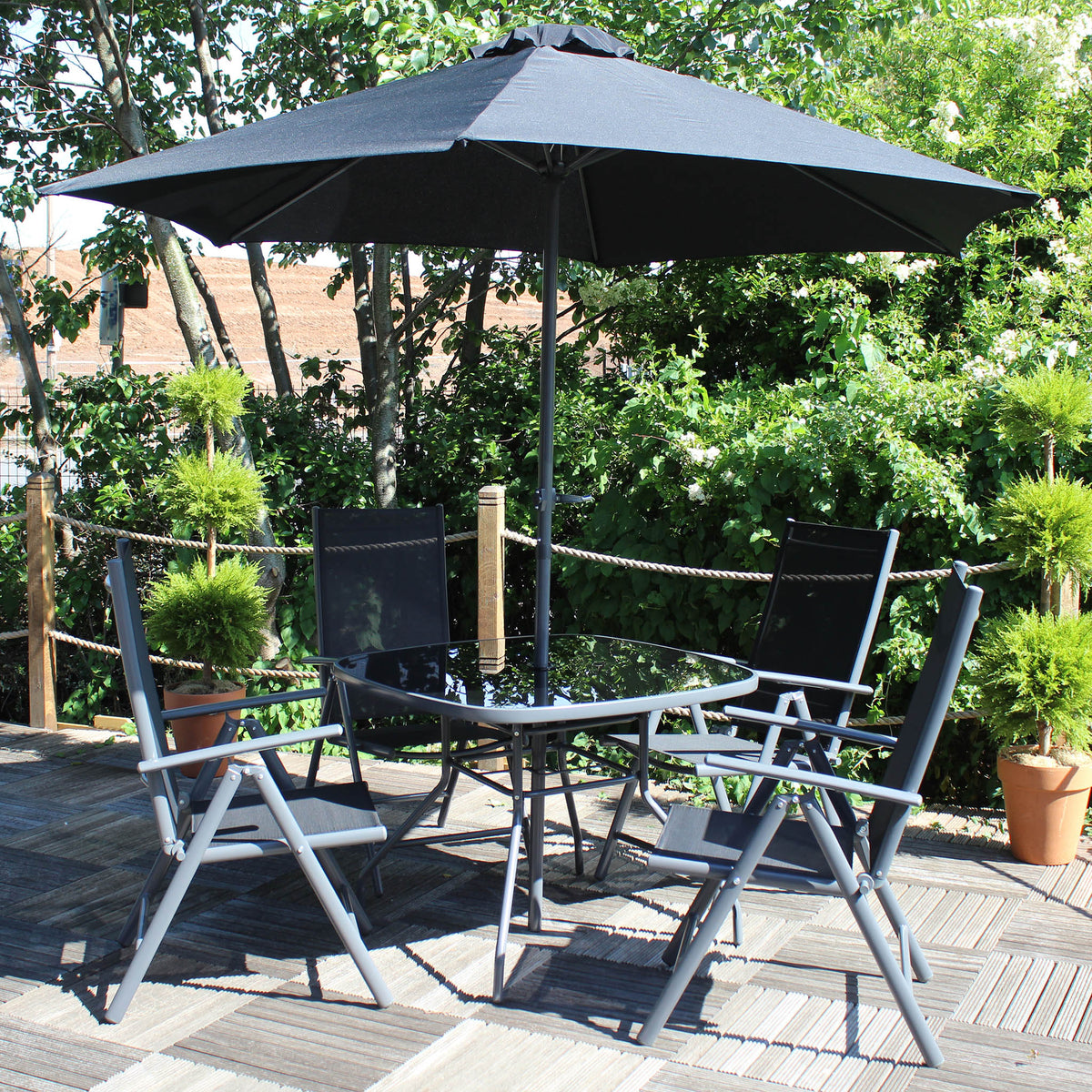 Rio Reclining 4 Seat Garden Dining Set with Parasol Lifestyle Setting
