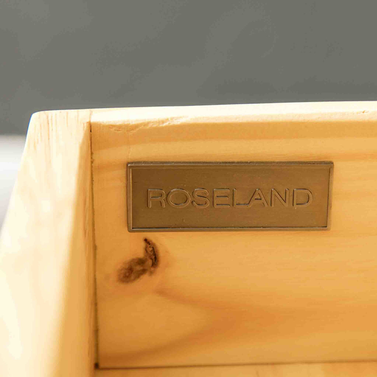 A Roseland Furniture badge on a London Oak 2 over 4 drawer bedroom chest. 
