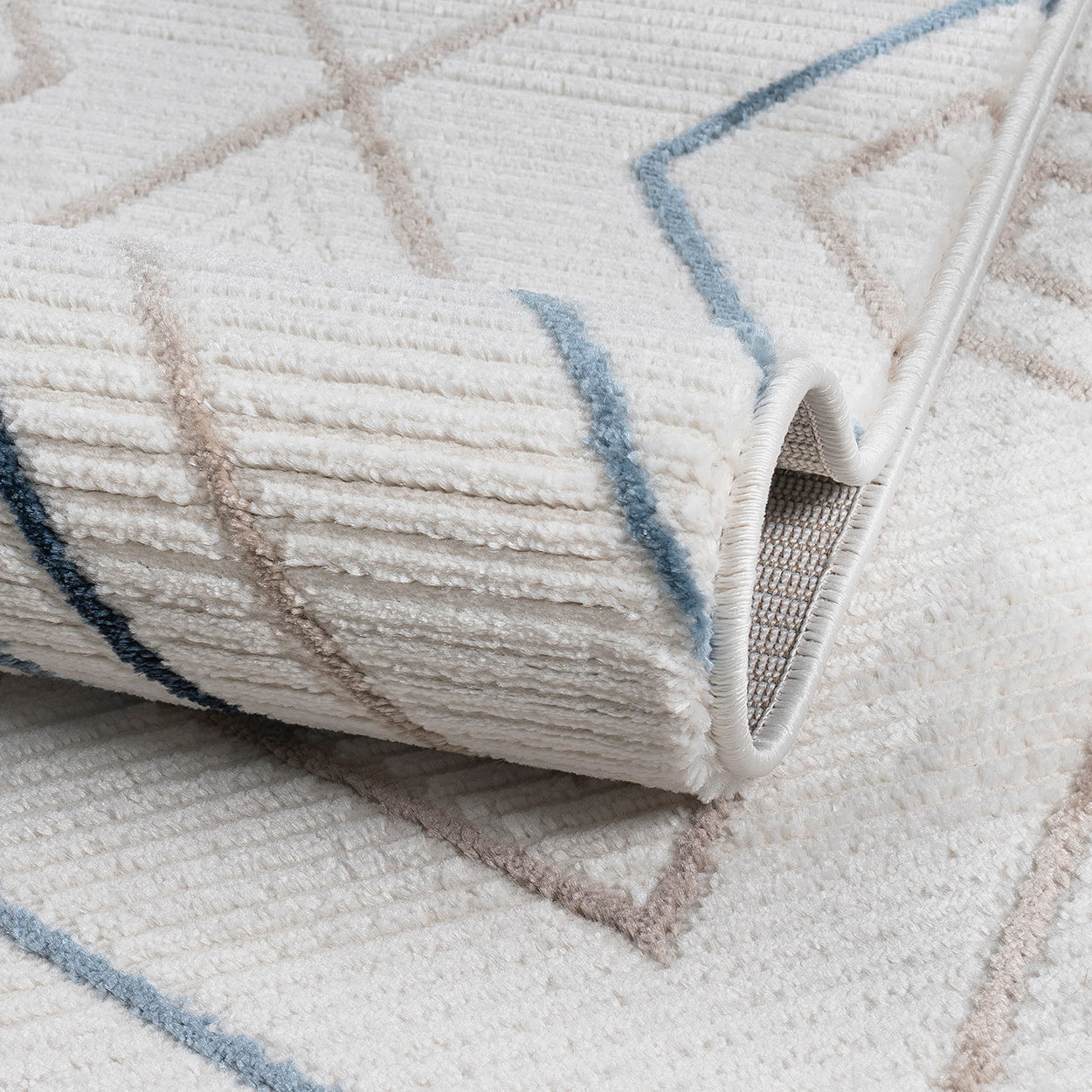 Close-up of a textured rug with geometric pattern