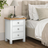Farrow White Bedside Table from Roseland Furniture - Lifestyle shot