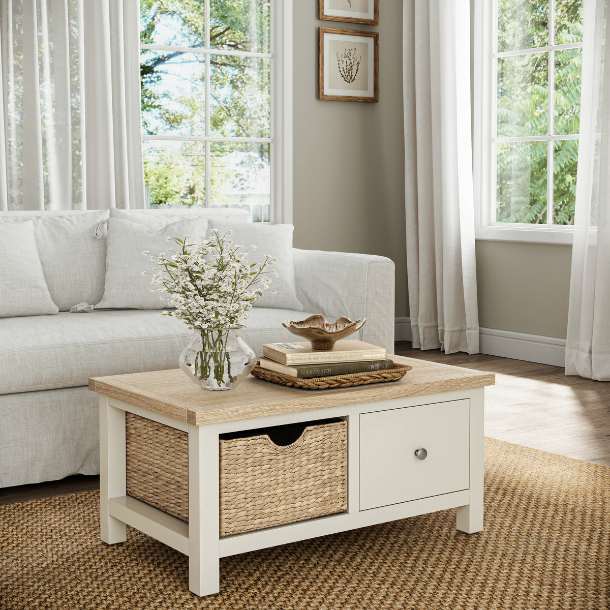 Farrow Basket Coffee Table from Roseland Furniture decorated with books and vases in a living room
