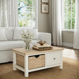 Farrow Basket Coffee Table from Roseland Furniture decorated with books and vases in a living room

