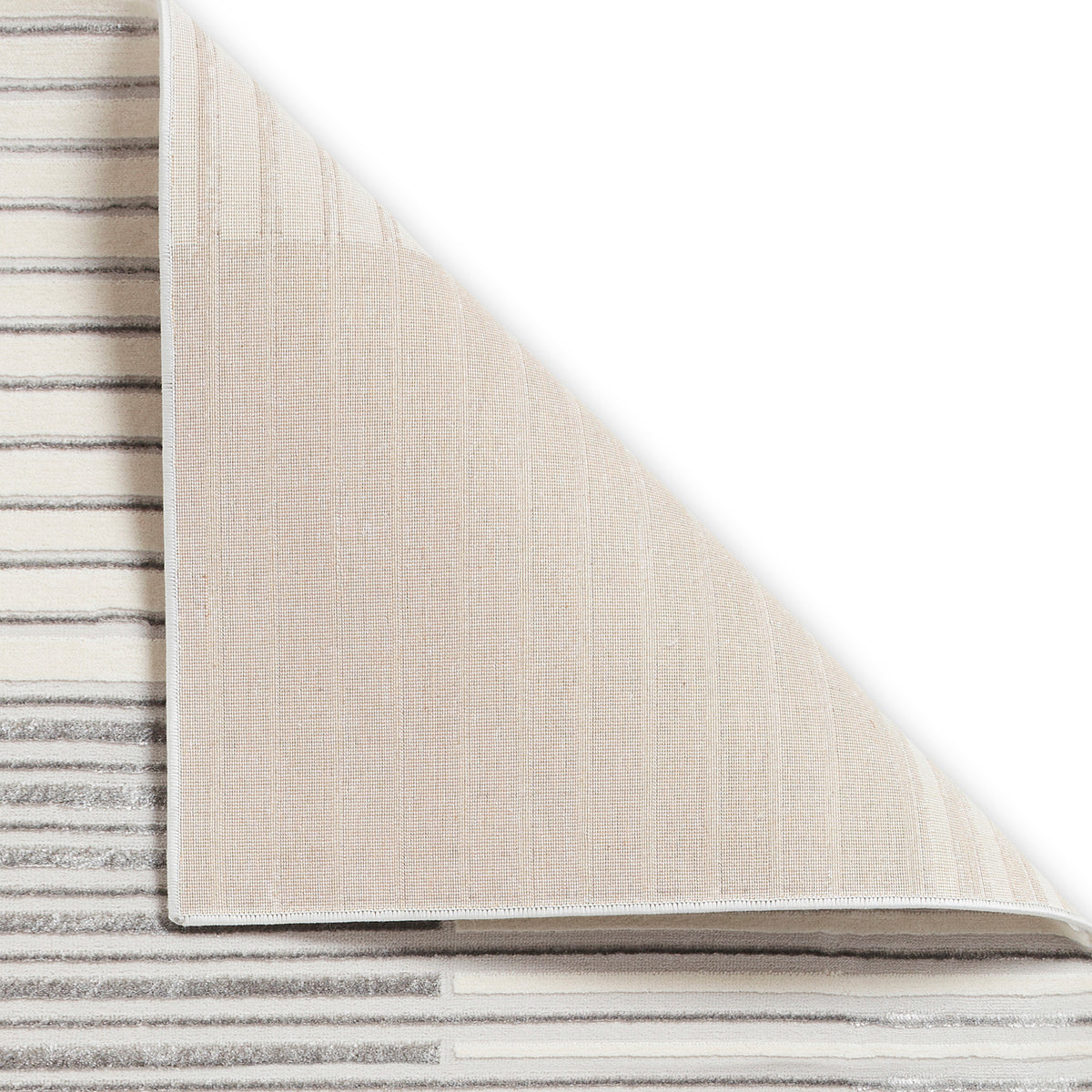 A beige carpet partially rolled up, revealing a striped pattern underneath, isolated on a white background.