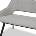 A grey fabric chair with a cutout backrest detail and black metal legs, displayed on a plain white background.