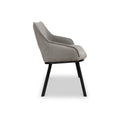 A modern chair with a textured gray upholstery stands idle against a pure white background. It features angled black wooden legs.