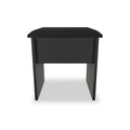 A black, rectangular bedside table with a simple design stands against a white background.