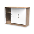A wooden TV stand with white sliding doors and circular cutouts for handles, isolated on a white background.