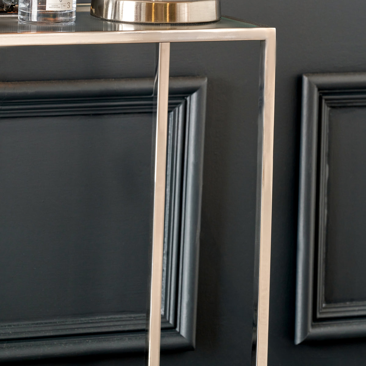 Aleandra Clear Glass and Silver Metal Console Table from Roseland Furniture