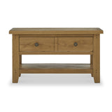 A wooden coffee table with two drawers and a lower shelf, isolated on a white background.