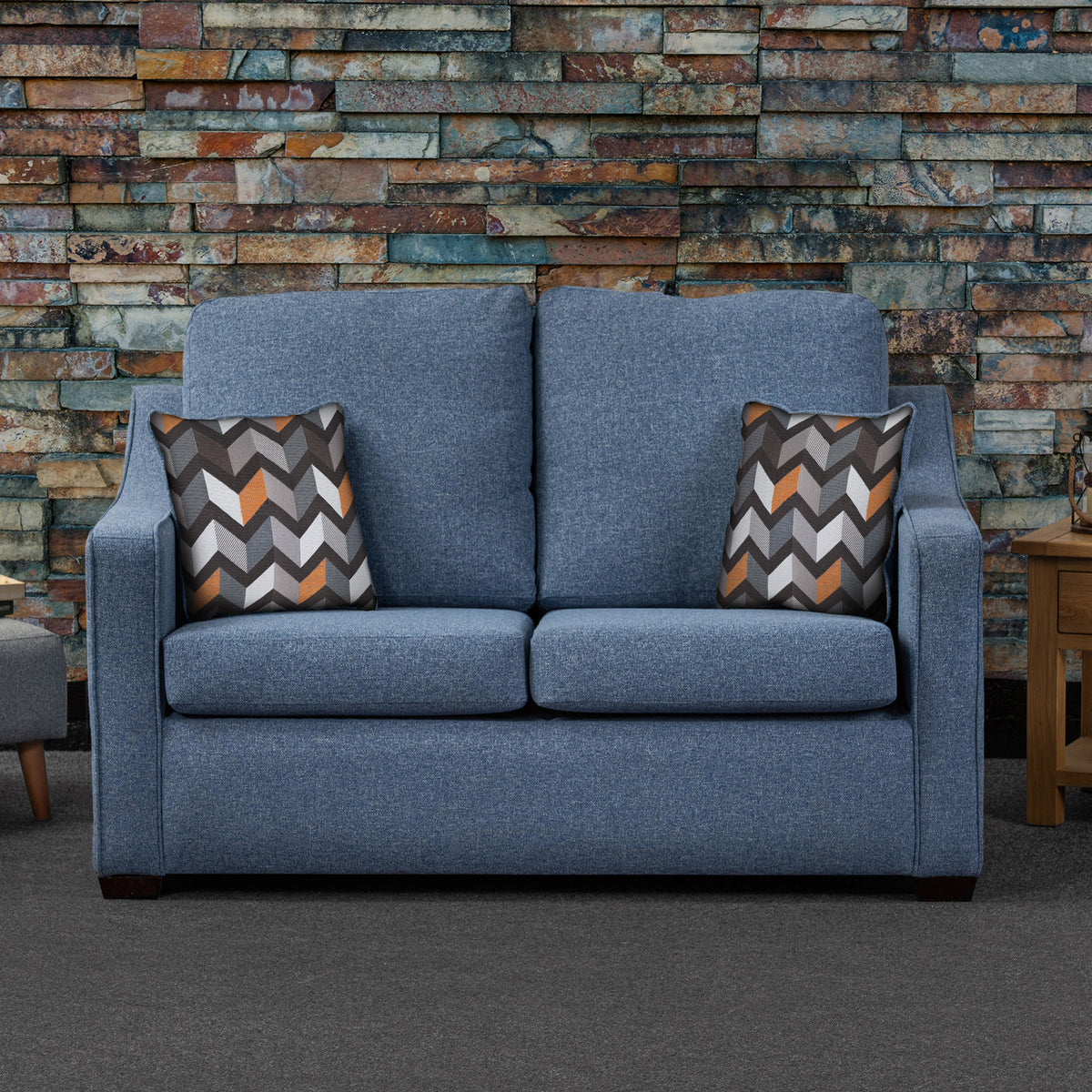 Charlcote Denim Faux Linen 2 Seater Sofabed with Charcoal Scatter Cushions from Roseland Furniture