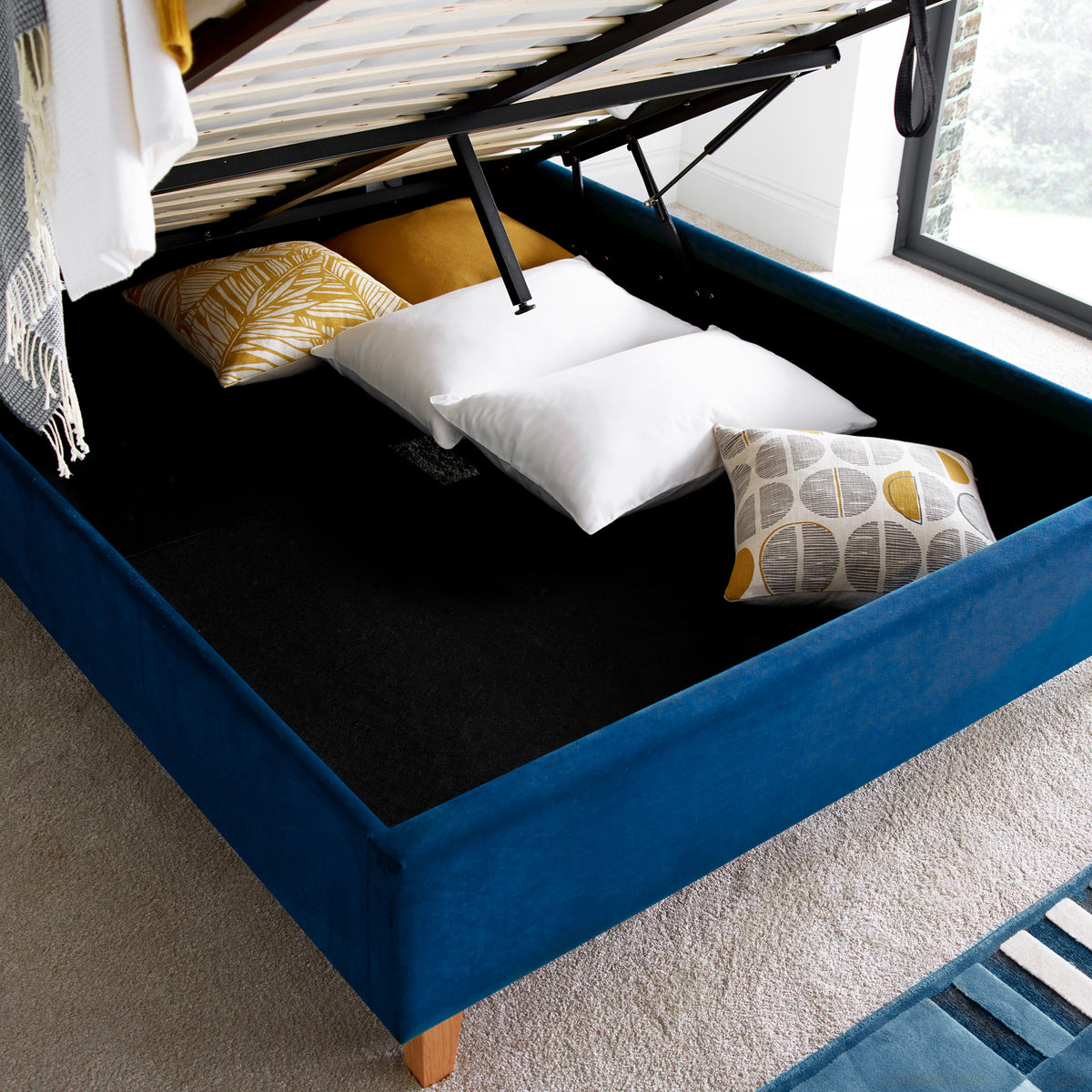 Kia Blue Velvet Ottoman Bed with storage