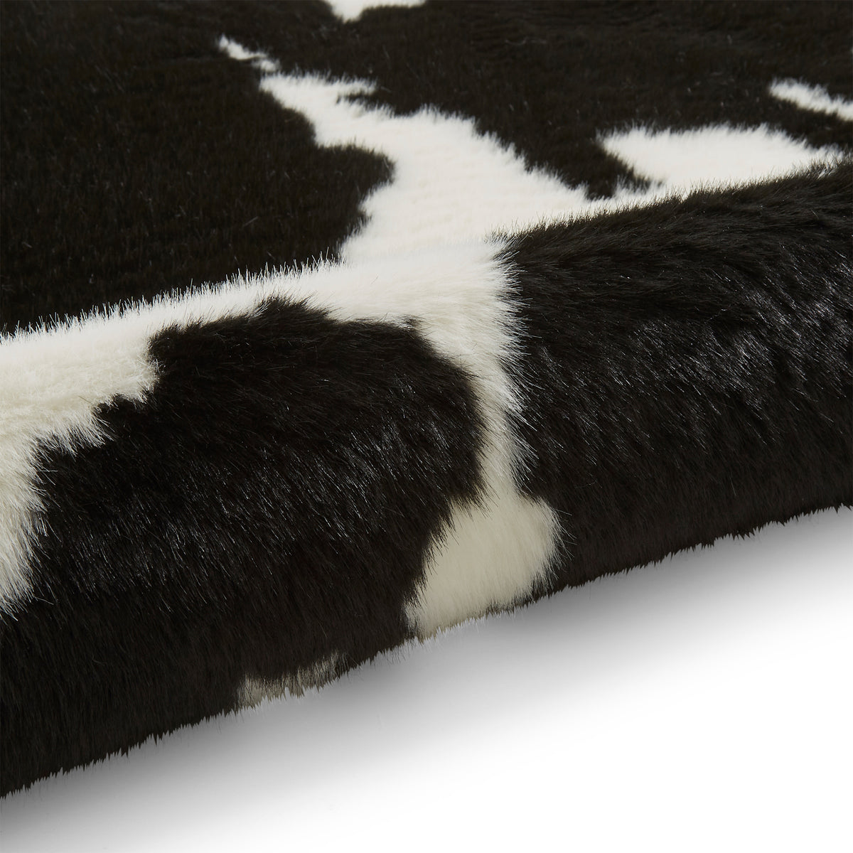 Bellaire Faux Cow Print Rug Black White from Roseland Furniture