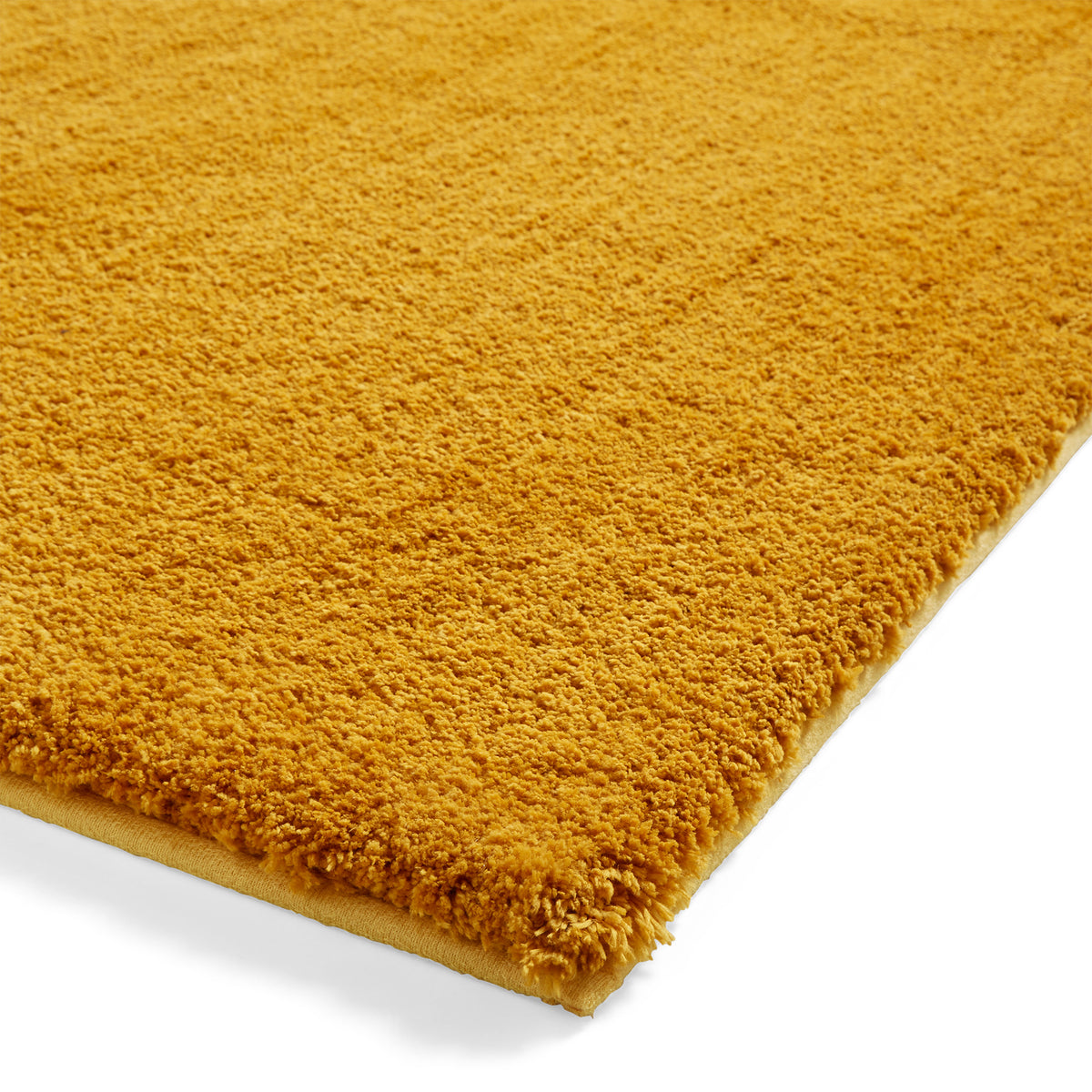 Mackenzie Washable Shaggy Rug Ochre from Roseland Furniture