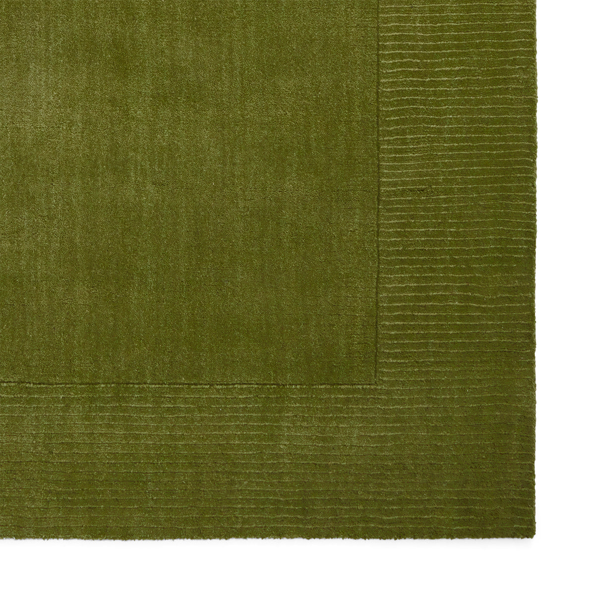 Lauder Plain Wool Border Rug Green from Roseland Furniture