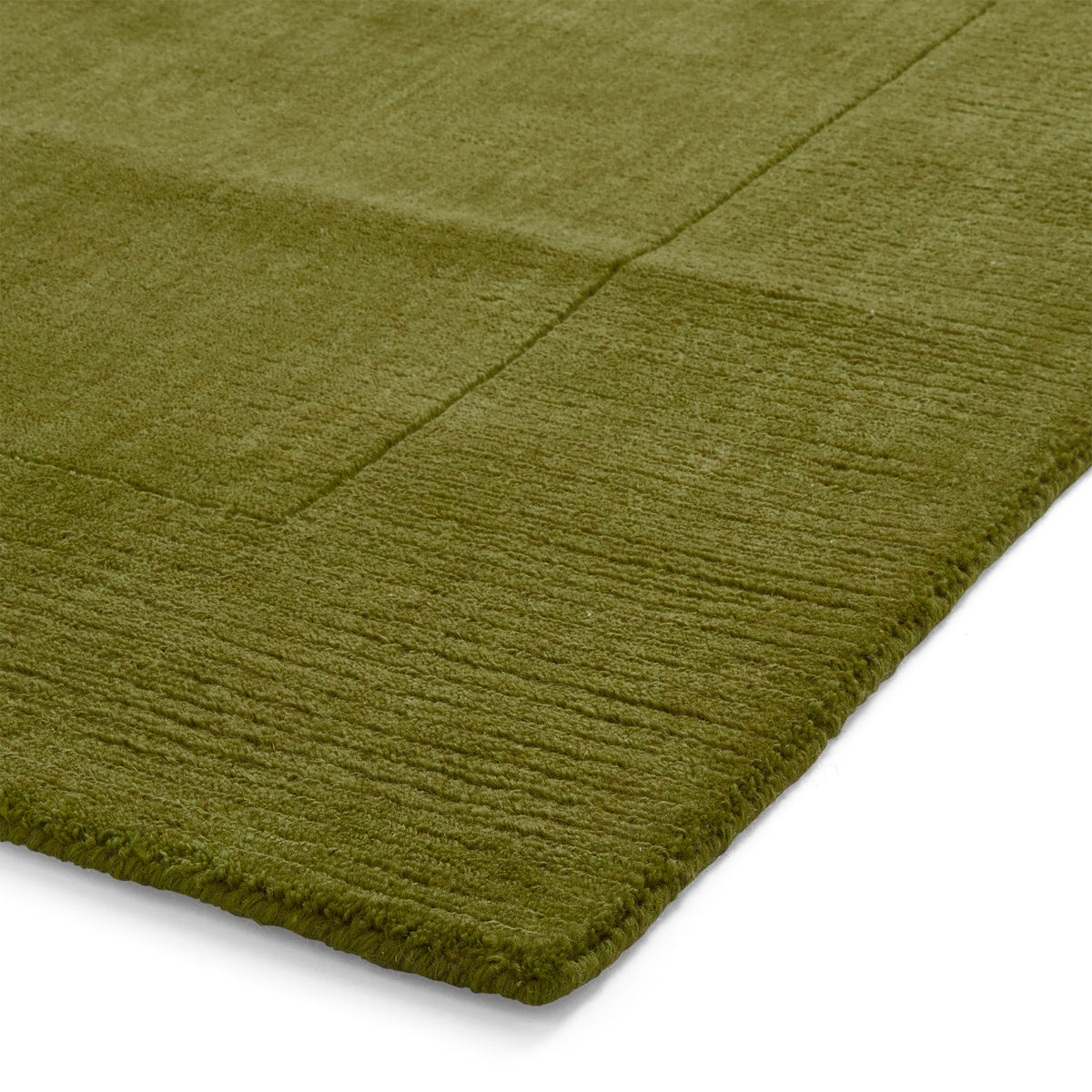 Lauder Plain Wool Border Rug Green from Roseland Furniture