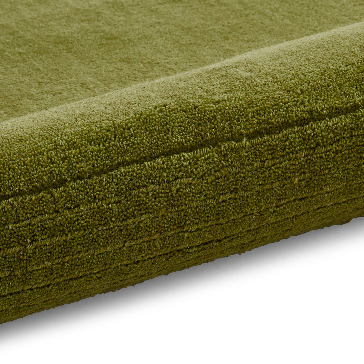 Lauder Plain Wool Border Rug Green from Roseland Furniture