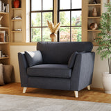 Osten Snuggler Armchair Navy Oak Feet from Roseland Furniture
