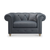 Everett Leather Snuggle Chair Navy Walnut Feet from Roseland Furniture