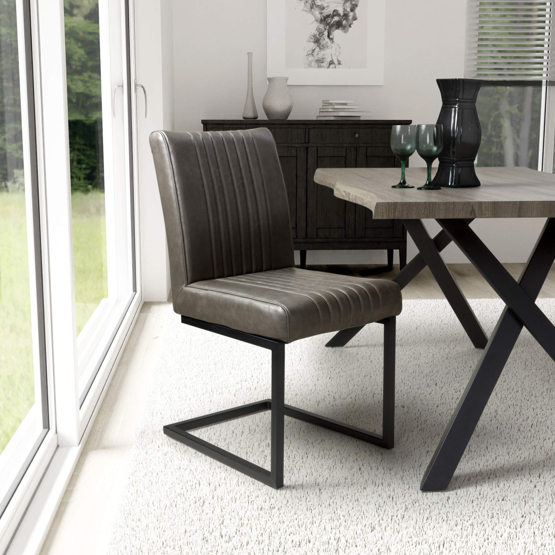 Branok Cantilever Grey Faux Leather Dining Chair from Roseland Furniture