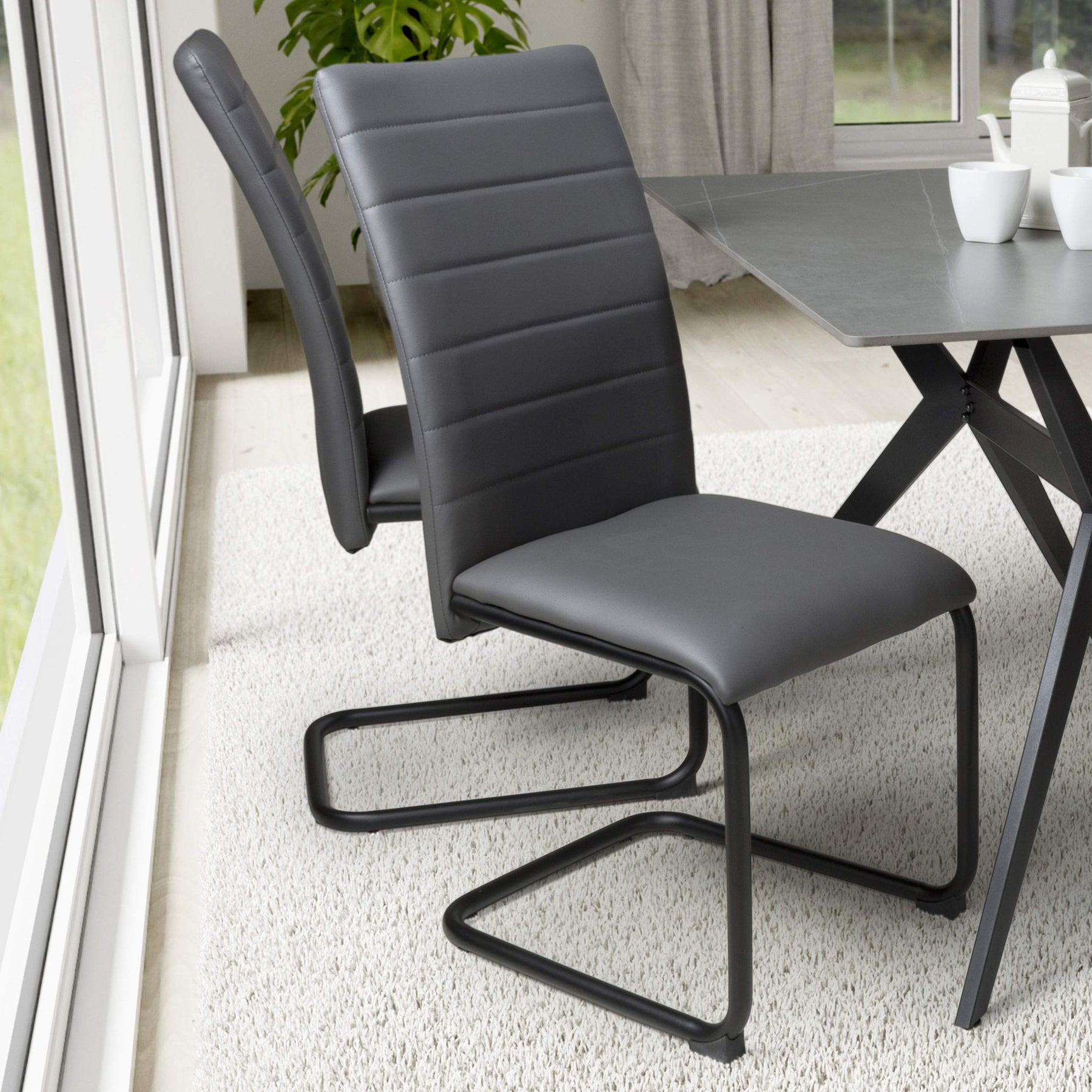 Aeron Faux Leather Dining Chair Grey from Roseland Furniture