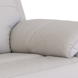 Beige leather sofa with a cylindrical cushion resting on its seat against a white background.