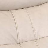 Close-up of a beige leather surface with visible stitching, likely a part of furniture such as a sofa or chair.