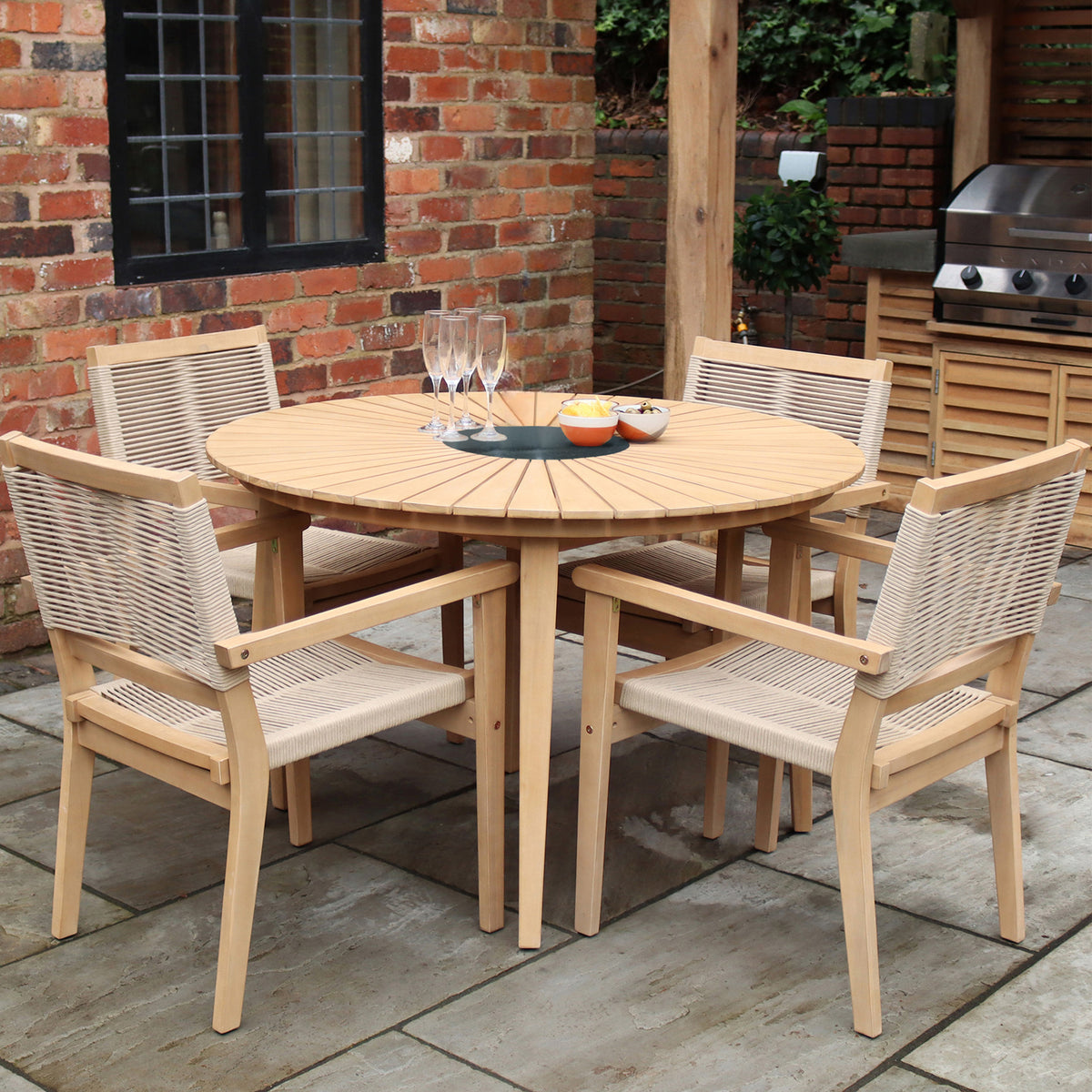 Roma 120cm Round Table 4 Roma Rope Stacking Chairs Granite Insert from Roseland Furniture