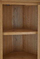 Zelah Oak Corner Display Cabinet
 - Close up of lower shelf and legs