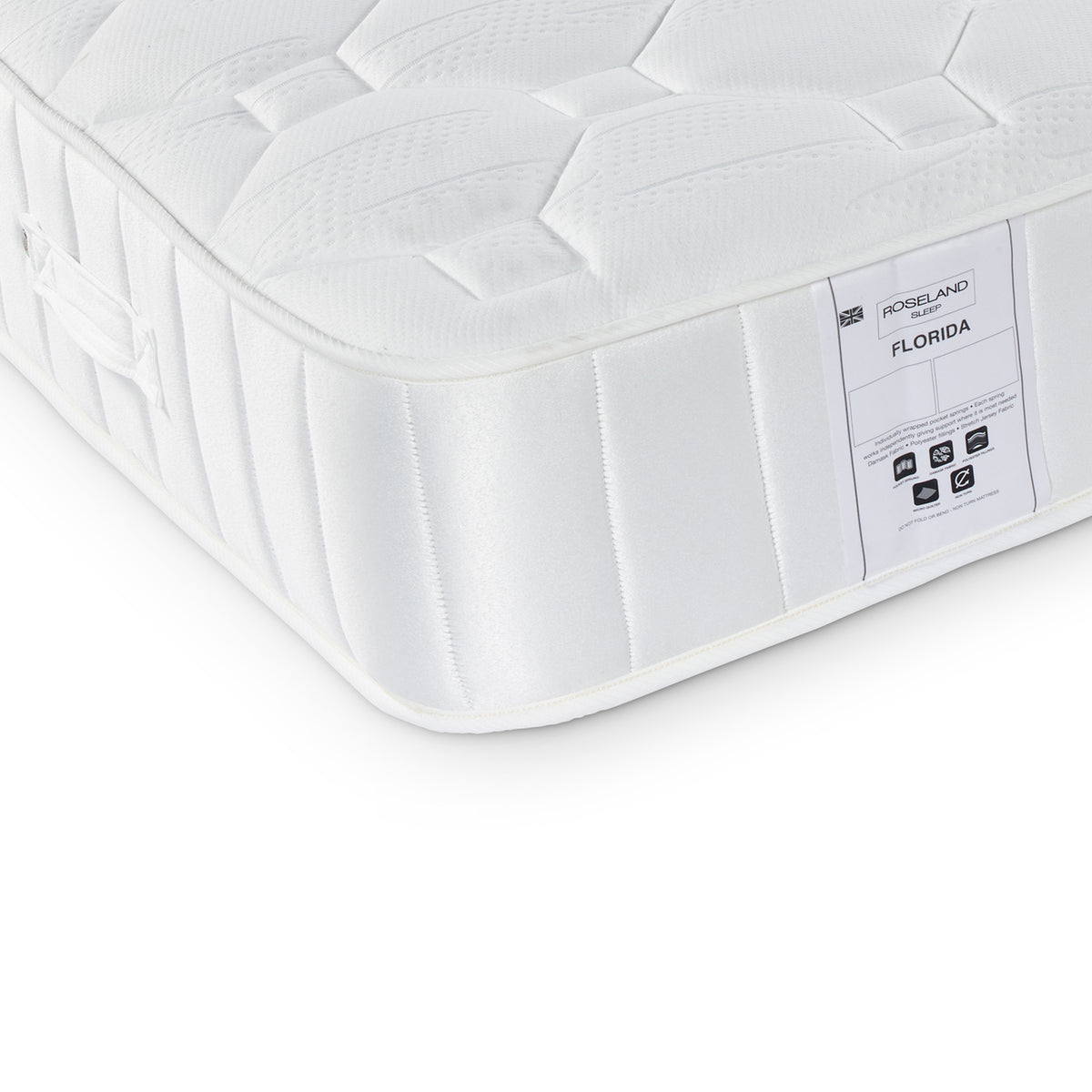 A white mattress with a quilted top and side labels indicating "ROSELAND FLORIDA," with symbols for recyclability and certifications, placed against a white background.