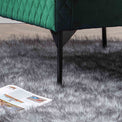 lifestyle close up of the black legs on the Bali Jasper Velvet Accent Chair