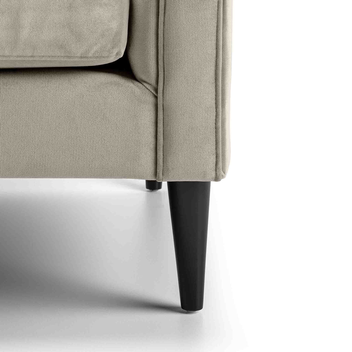 close up of the mid century solid wood tapered legs on the Savoy Putty Velvet 2 Seater Accent