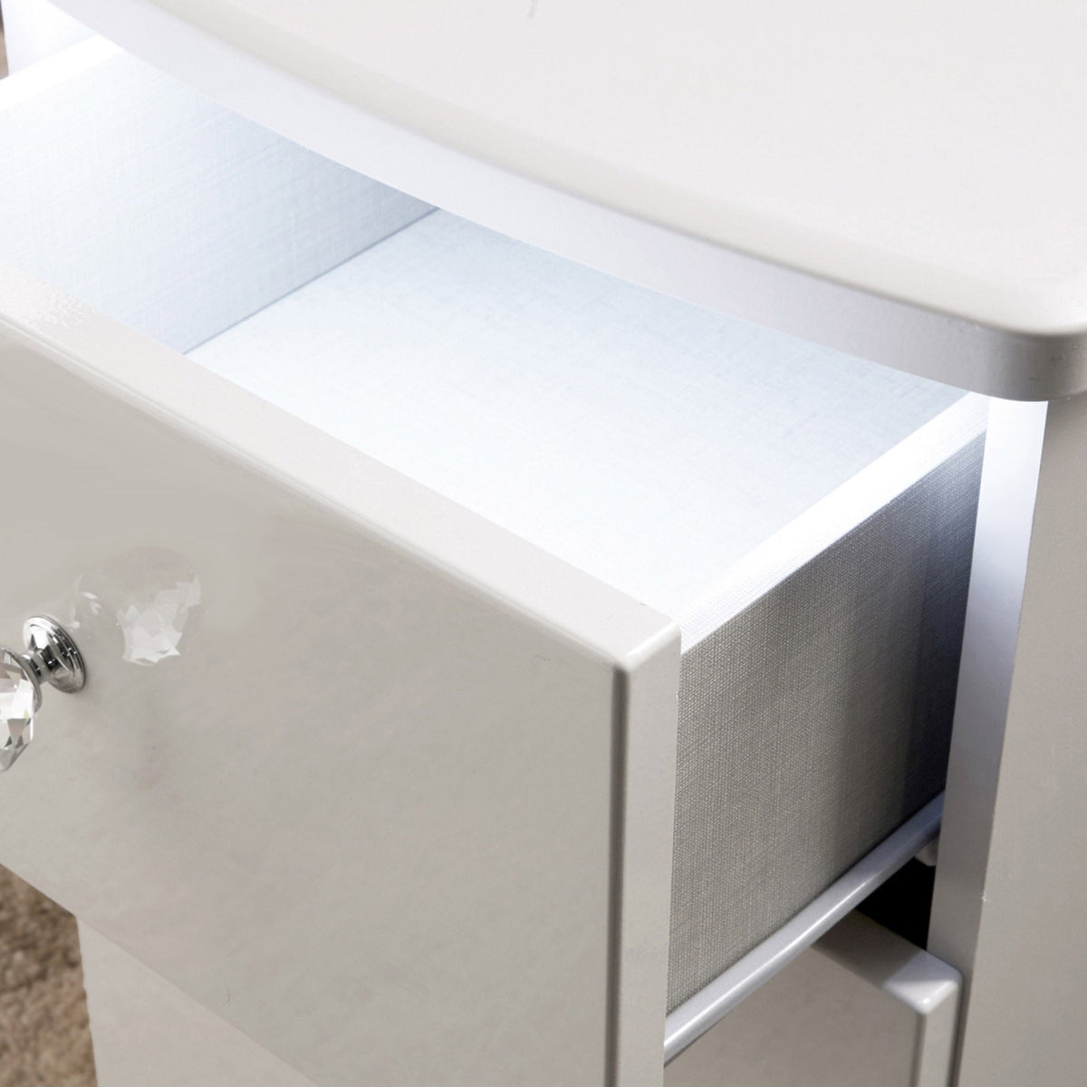 Aria white gloss LED lighting 6 drawer chest close up